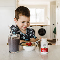 child eating breakfast with product on table