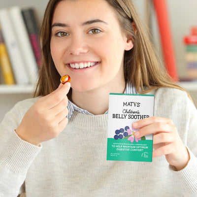 girl taking belly soother lozenge