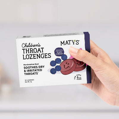 hand holding maty's children throat lozenges